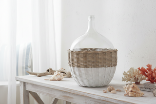 21 Inch Clear Glass Bottle in White and Tan Wicker Basket
