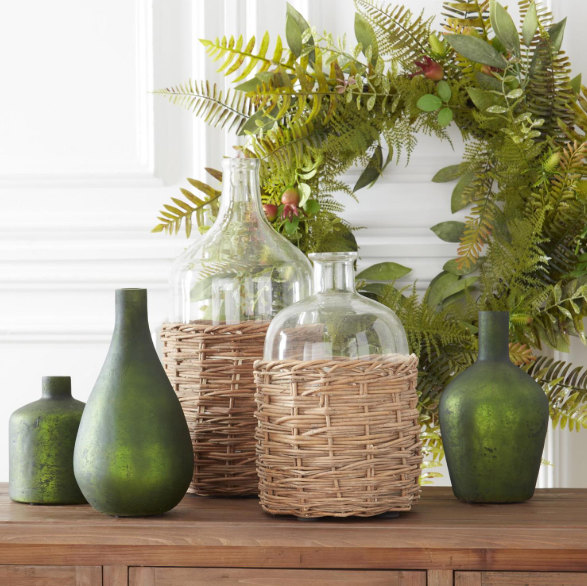 Large Clear Glass Bottles in Woven Rattan Basket